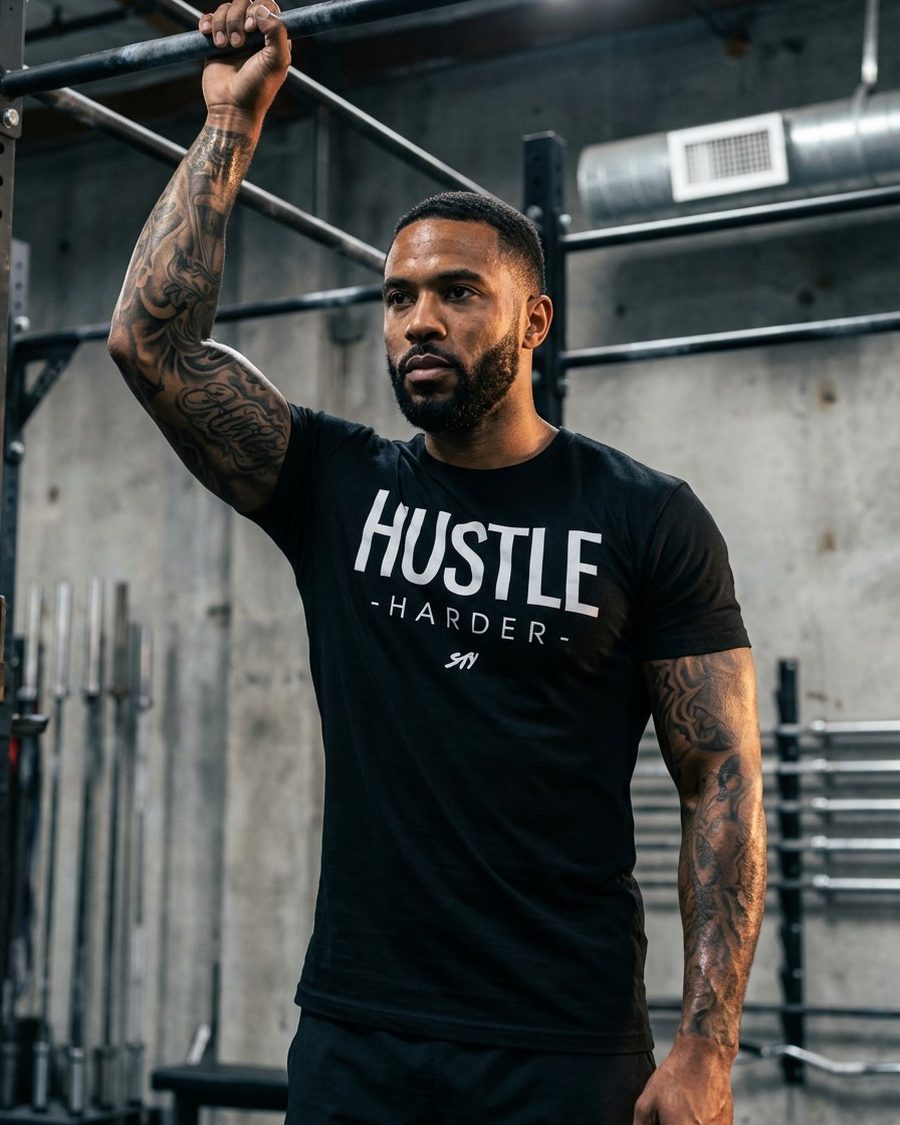 Hustle Harder tee, on model in the gym