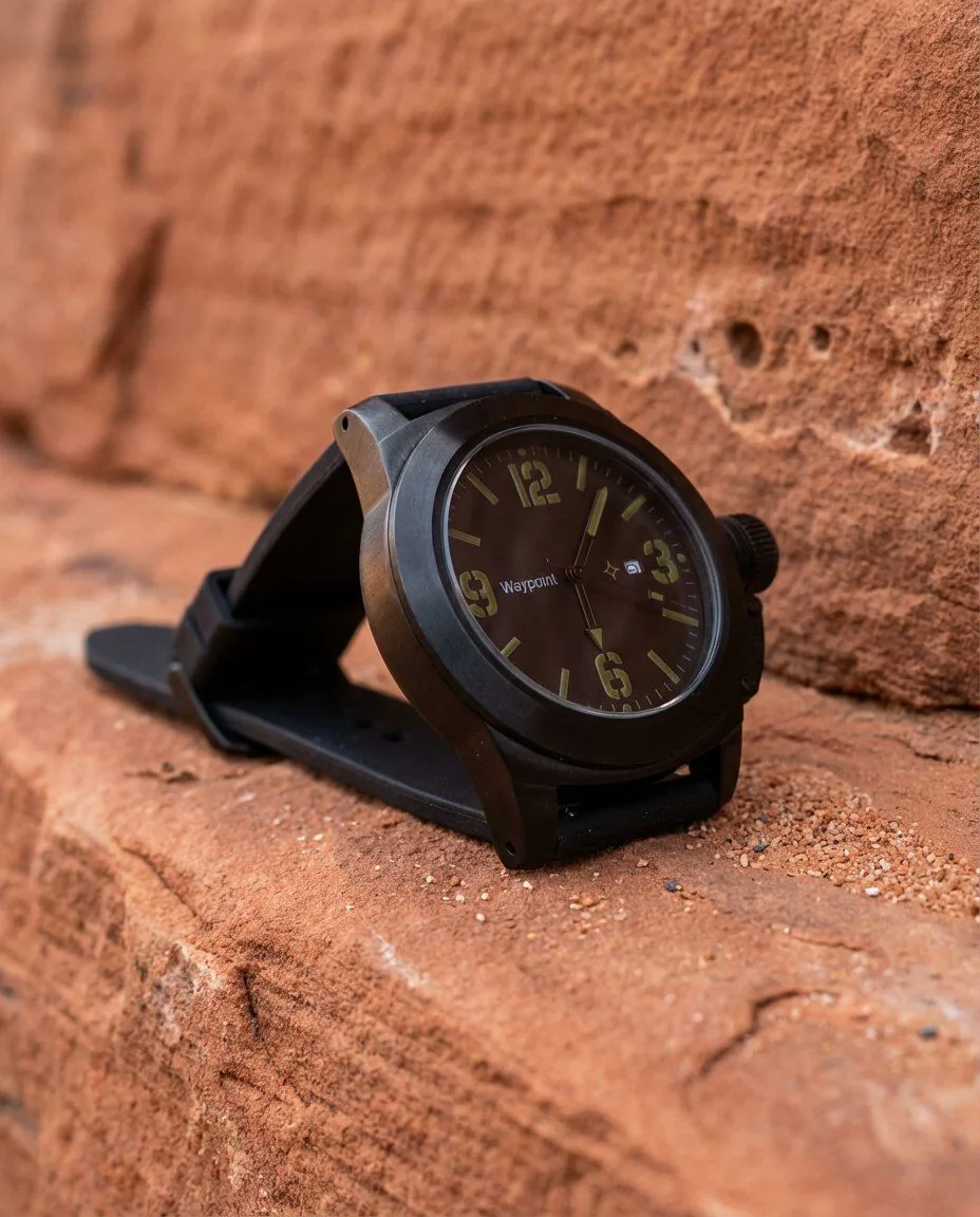 The Mojave field watch — matte black PVD on red sandstone